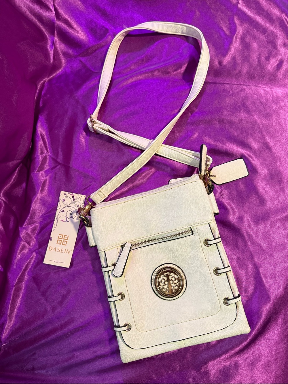 Cream Crossbody Bag with Decorative Emblem